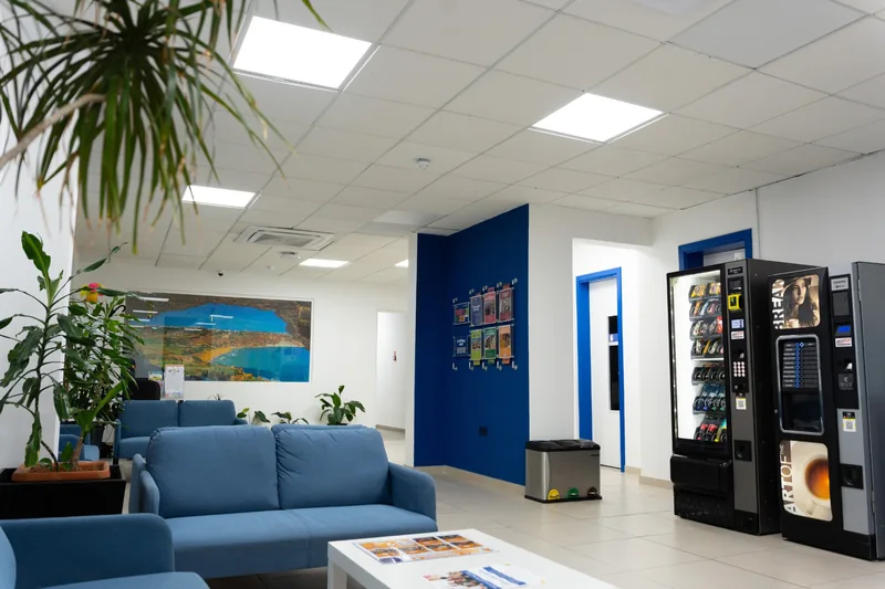 The student lounge at IH Malta, with vending machines and a noticeboard