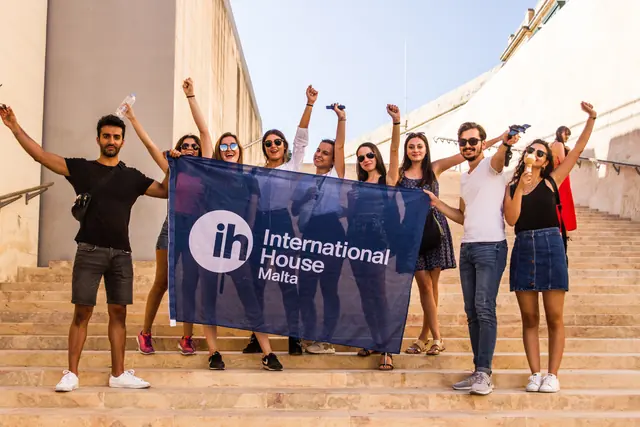 A group of IH Malta students on the steps in Valletta