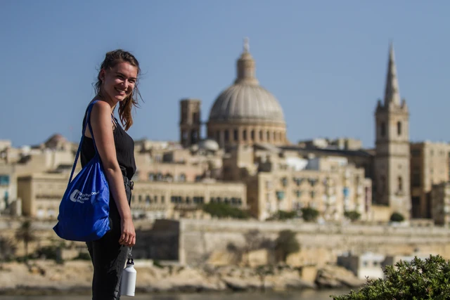 An IH Malta student with Valletta behind her